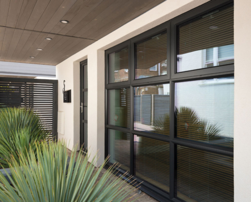 Draughty Door Solutions commercial windows and doors fitted by Faron in Crawley