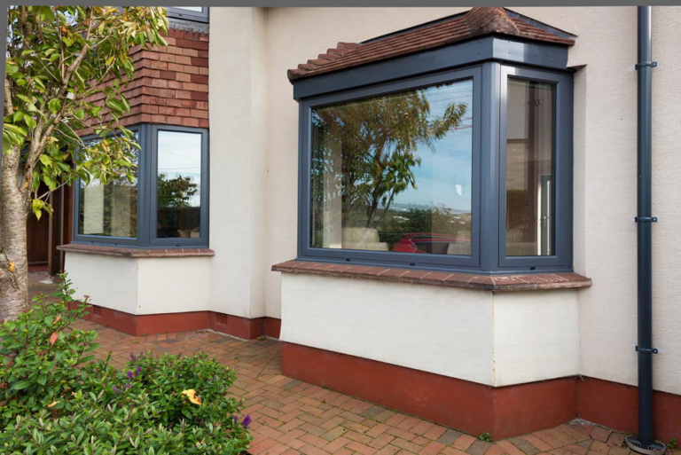 Grey double glazed bay window, an example of how much double glazing can cost